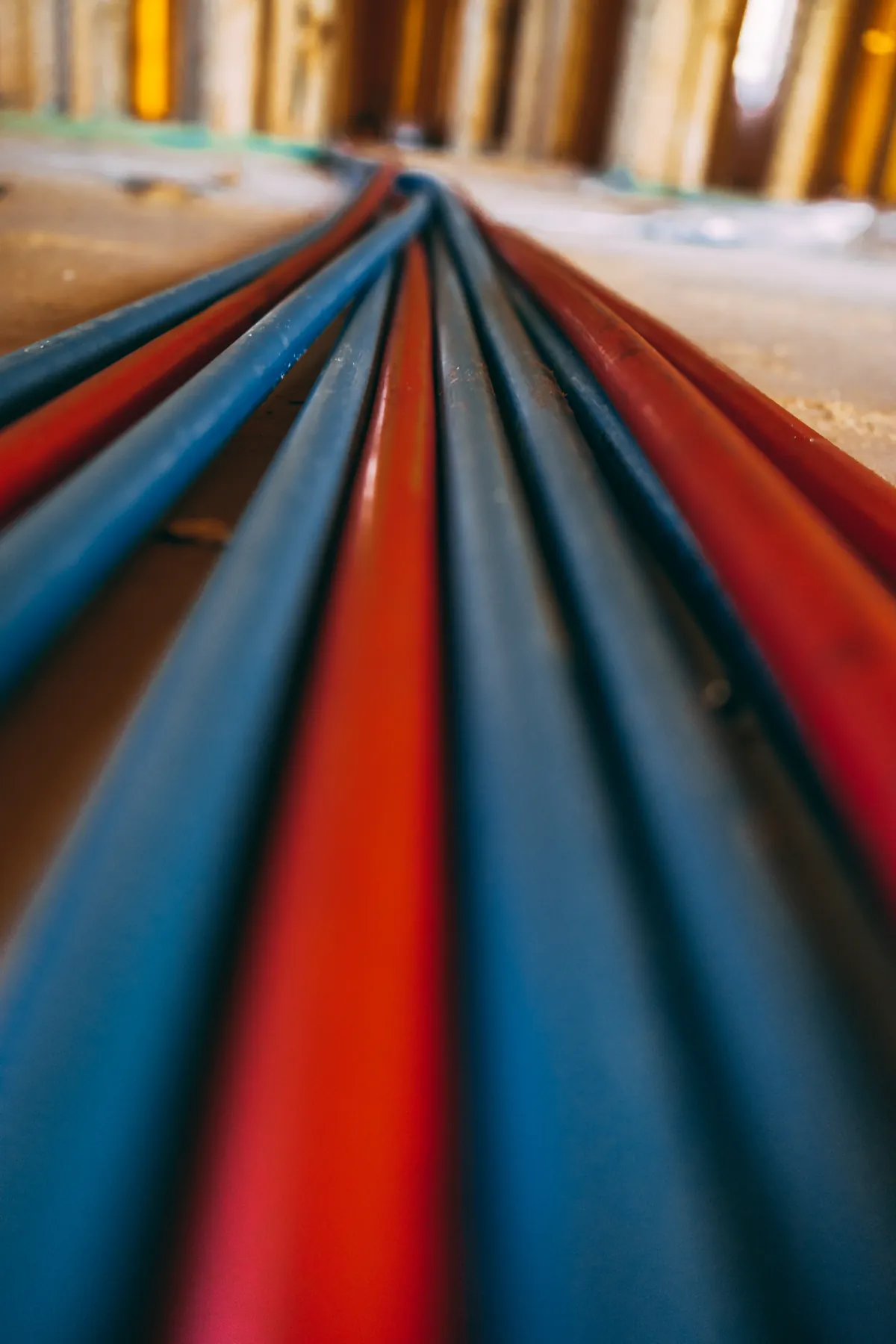 Coiled red and blue PEX tubing ready for a repipe, from our Newport Beach guide: How to Prepare Your Newport Beach Home for a Whole
